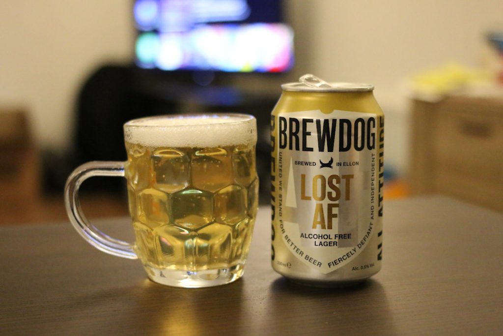 Low-alcohol Brewdog Lost AF beside a filled beer mug